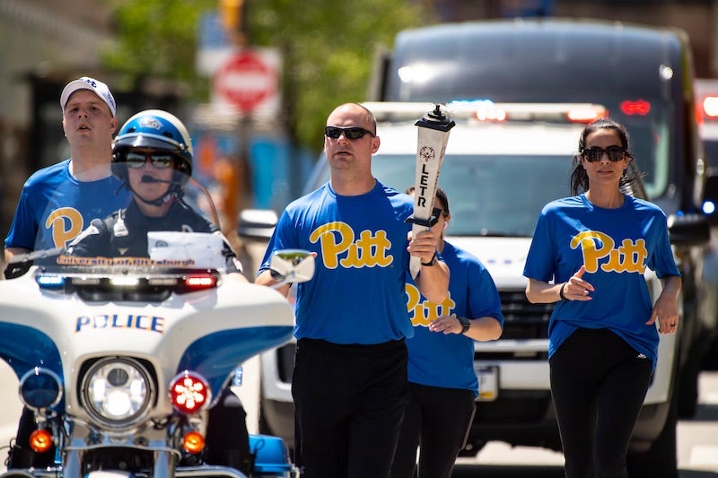 Pitt Police officers running