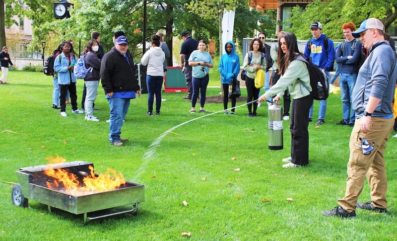 student putting out a fire