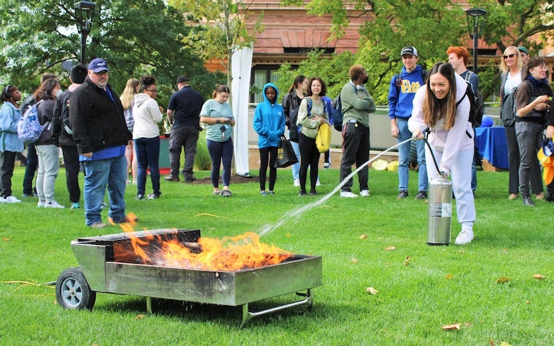 student putting out a fire