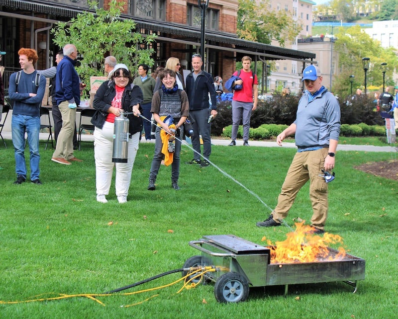 student putting out a fire