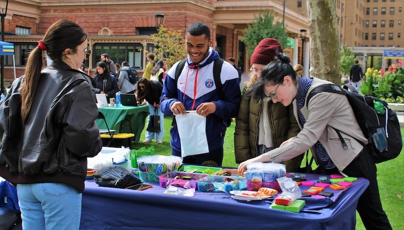 students standing around a table