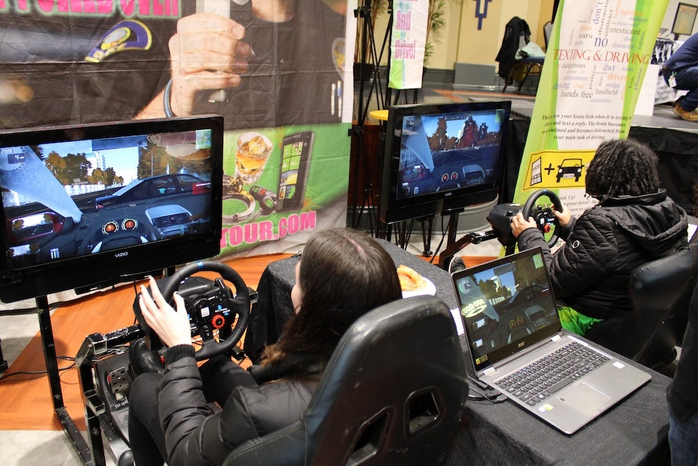 people using a driving simulation