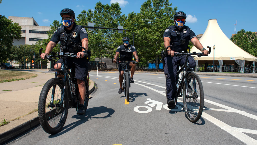 Police on bikes wearing mask