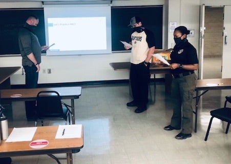 three officers in a classroom during ABLE Training