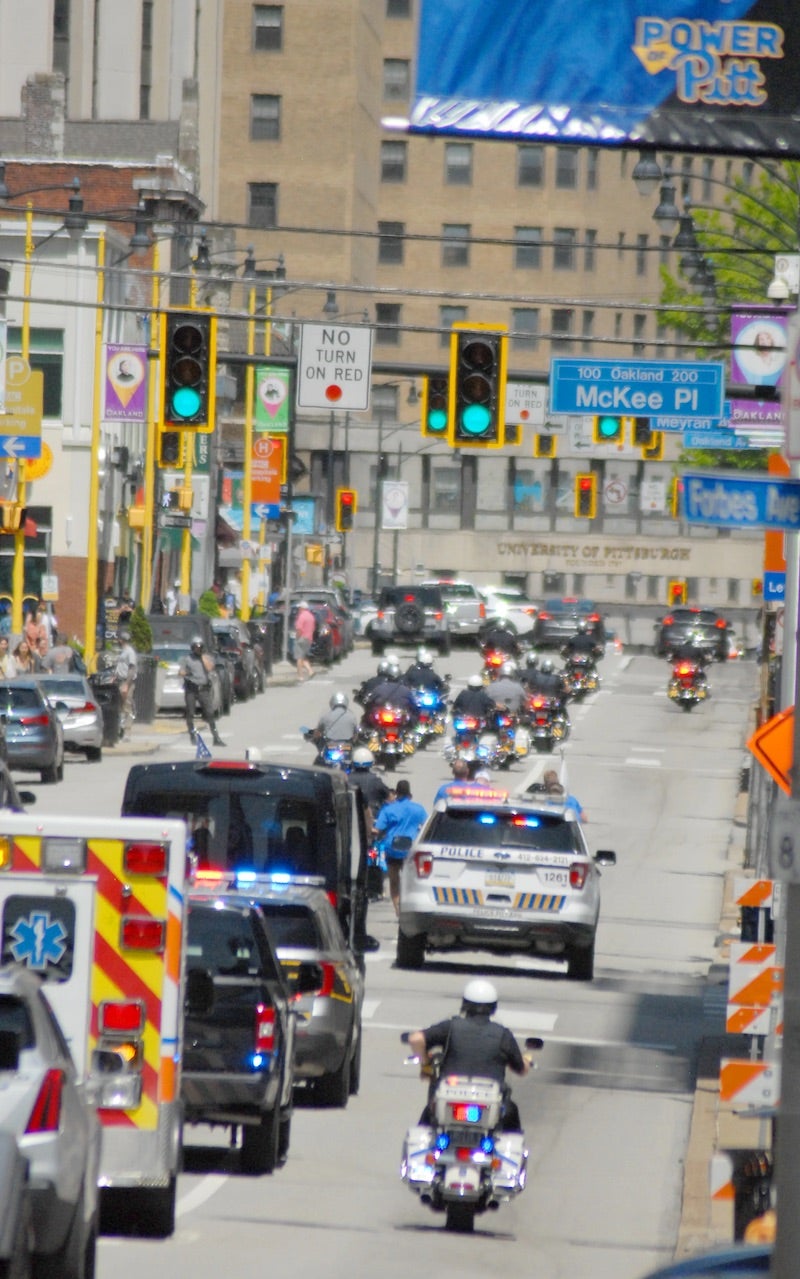 Police cars and motorcycles on Forbes avenue