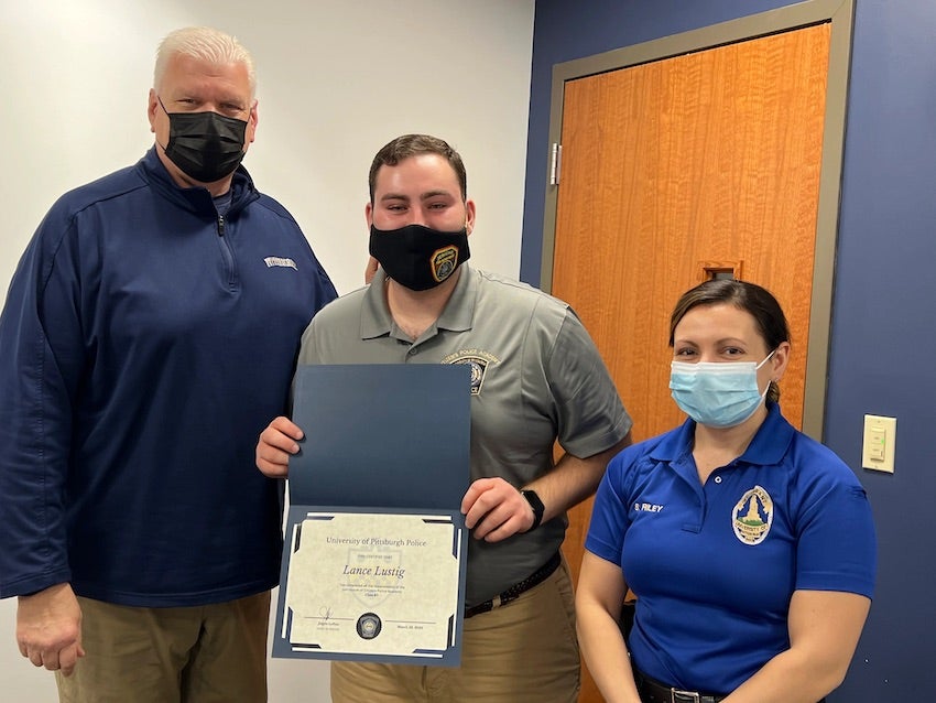 Lance Lustig receives his graduation certificate