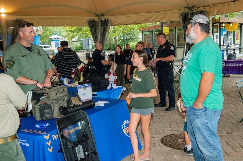 people talking at a Pitt Police Department table