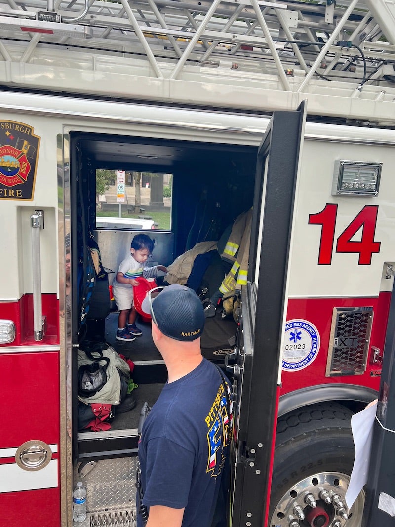 a child inside a firetruck