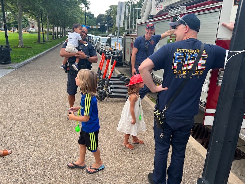 kids outside of a firetruck