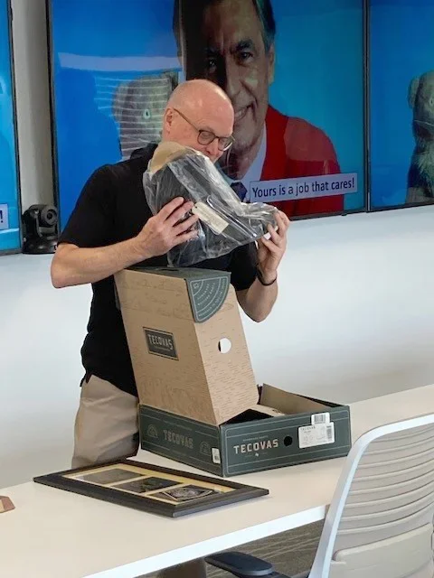 Rick Troy opening a shoe box