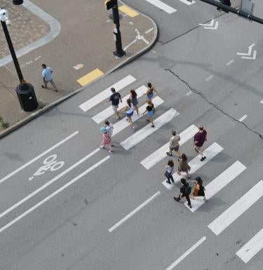 Group of people walking at a crosswalk