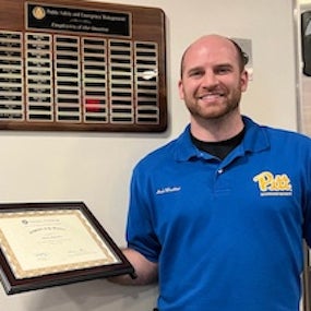 Mark Waechter holding award